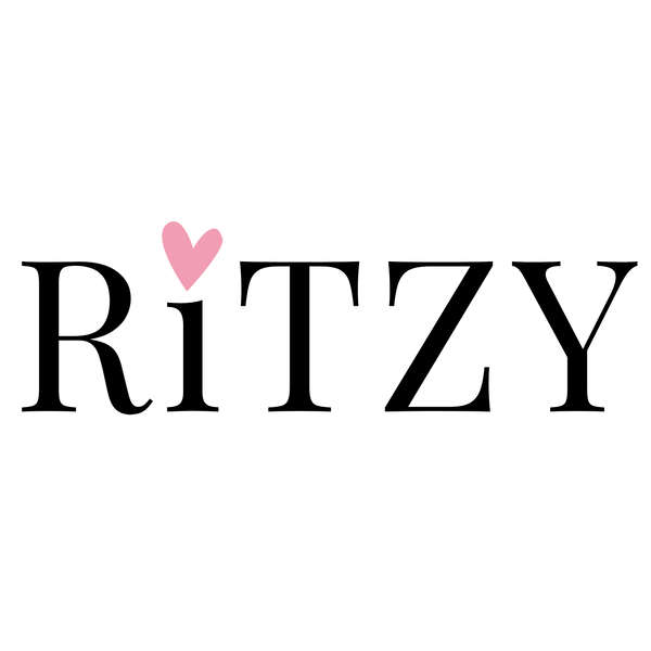 Logo of 'Ritzy' with a pink heart on a white background